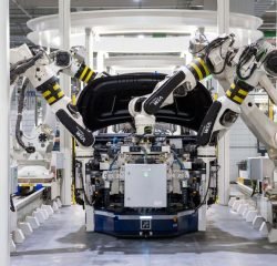 pexels-photo-19233057-19233057 High-tech robots assembling a car in a modern factory setting, showcasing automation.